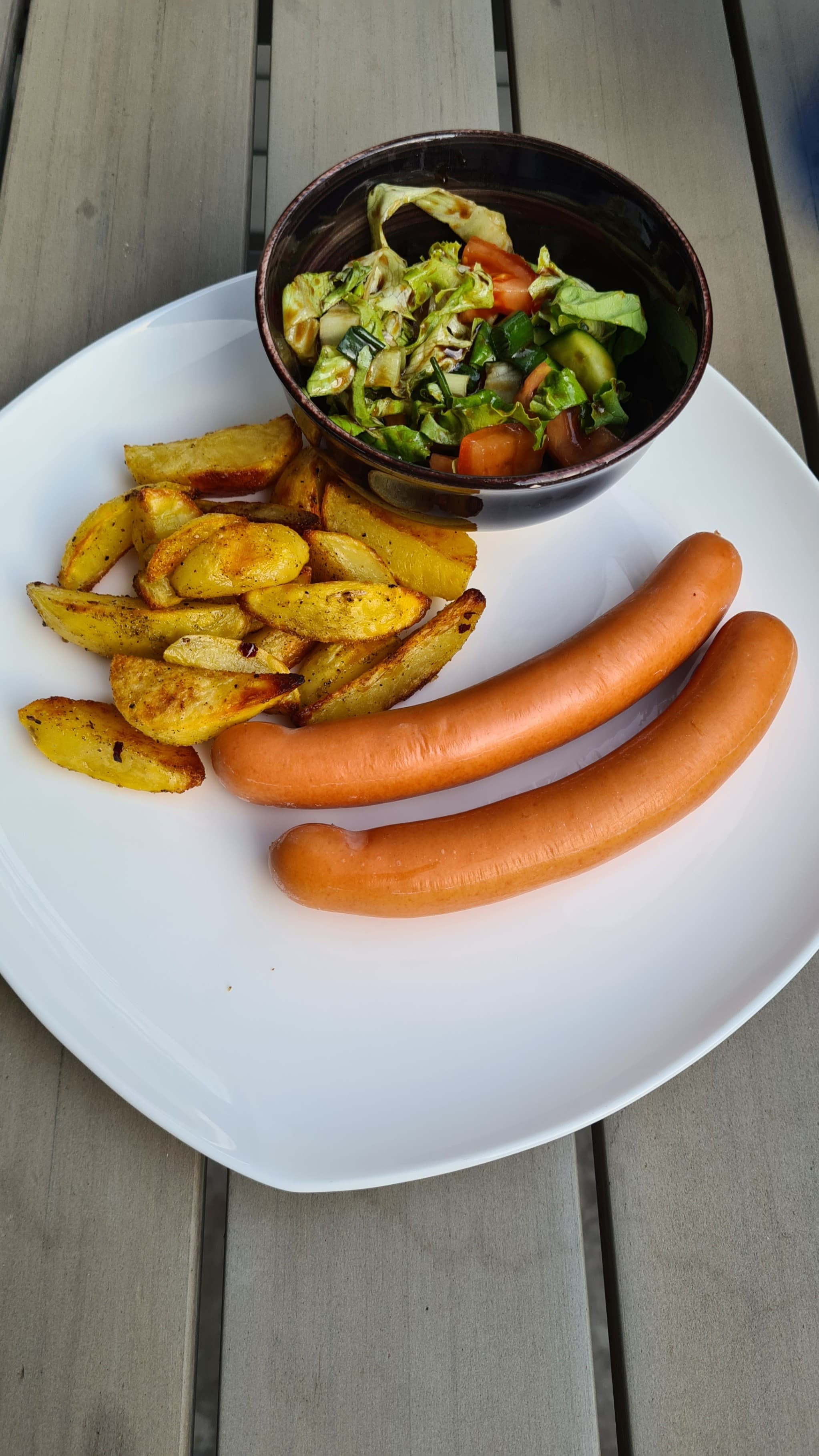 Sausages with Baked Potatoes and Fresh Salad Recipe Image